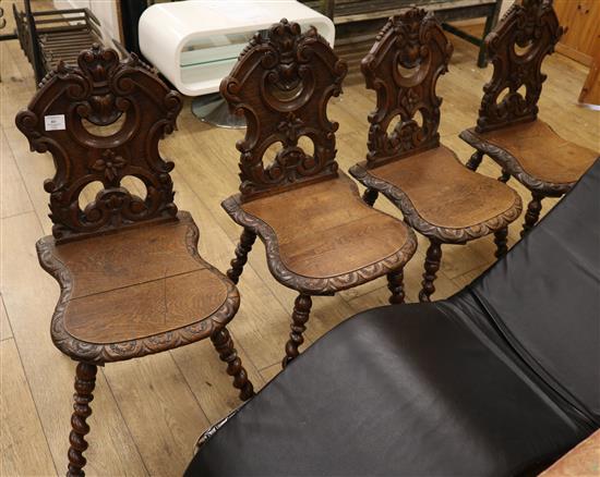 Four carved oak hall chairs